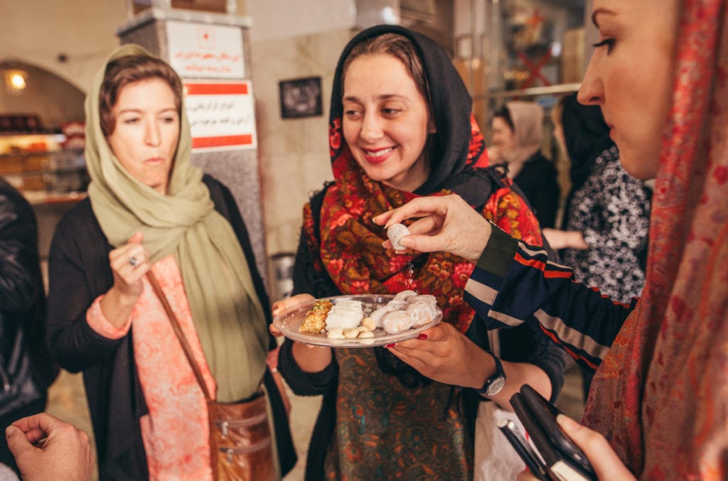 Nadia Badiee serves local treats to her tour © | Damian Raggatt/Intrepid Travel