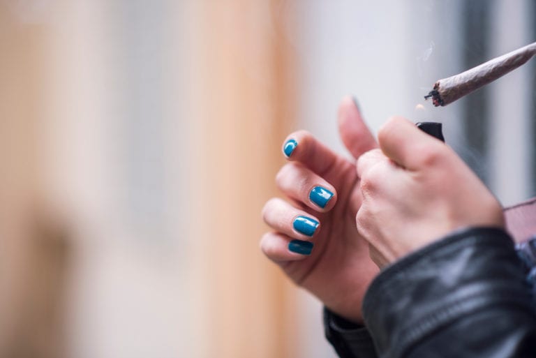 A woman lights up a joint © | Teodor Lazarev/Shutterstock