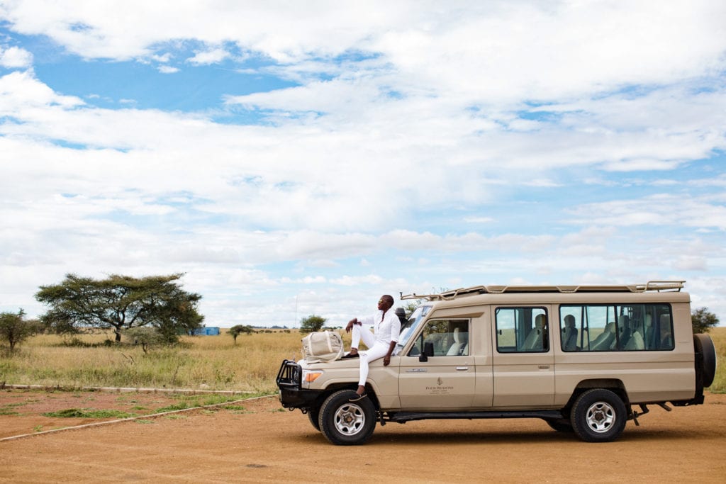 Jessica Nabongo and her journey to travel to every country. Here she poses in the Serengeti in Tanzania | © Elton Anderson