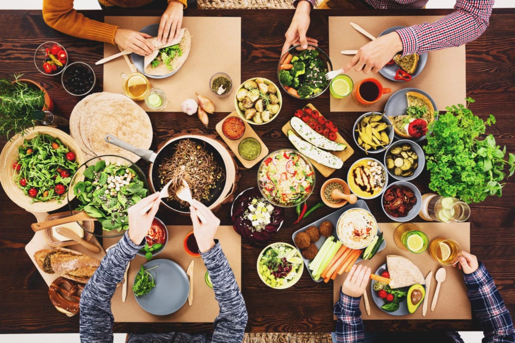 Friends enjoying a vegan meal | © Photographee.eu/Shutterstock