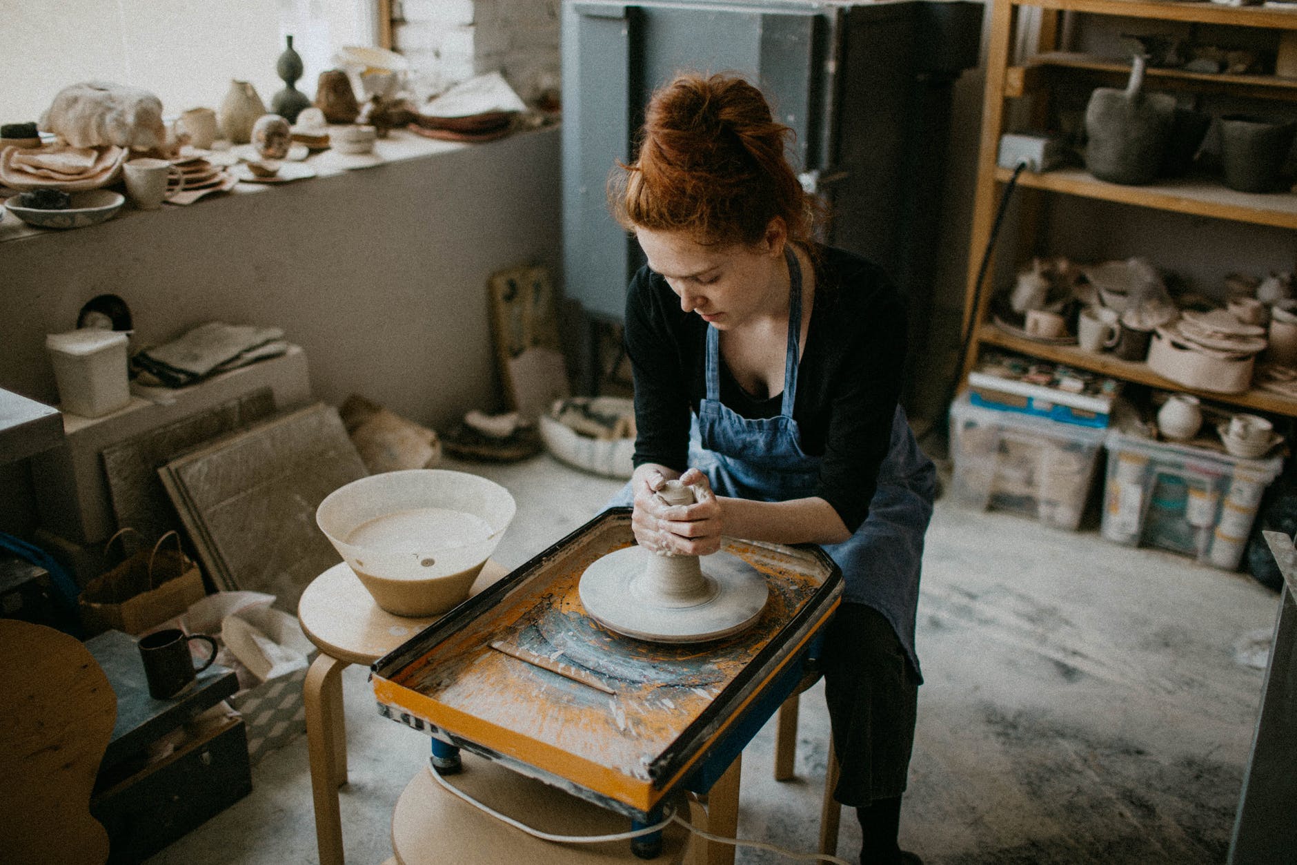 woman holding clay