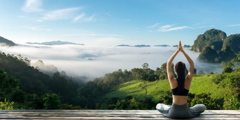 Woman practicing yoga in nature | © Pakorn Khantiyaporn/Shutterstock