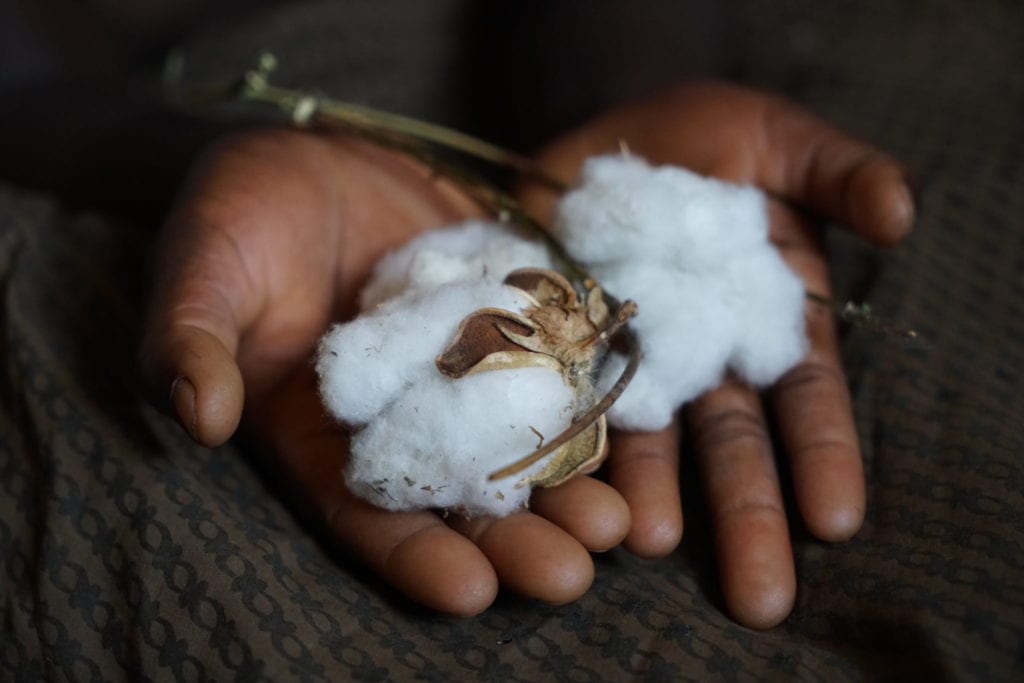 Doris, 19, holds lint cotton she uses during menstruation | © WaterAid/ Chileshe Chanda