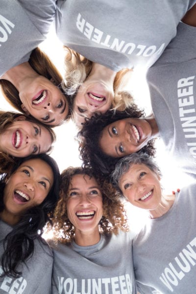 A group of female volunteers pose for a photo | © Shutterstock