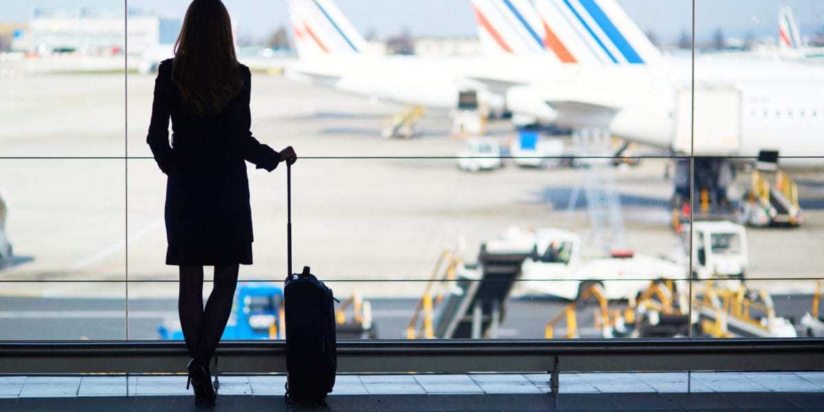 A woman's silhouette stands in front of a window at the airport | © Ekaterina Pokrovsky/Shutterstock