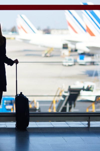 A woman's silhouette stands in front of a window at the airport | © Ekaterina Pokrovsky/Shutterstock