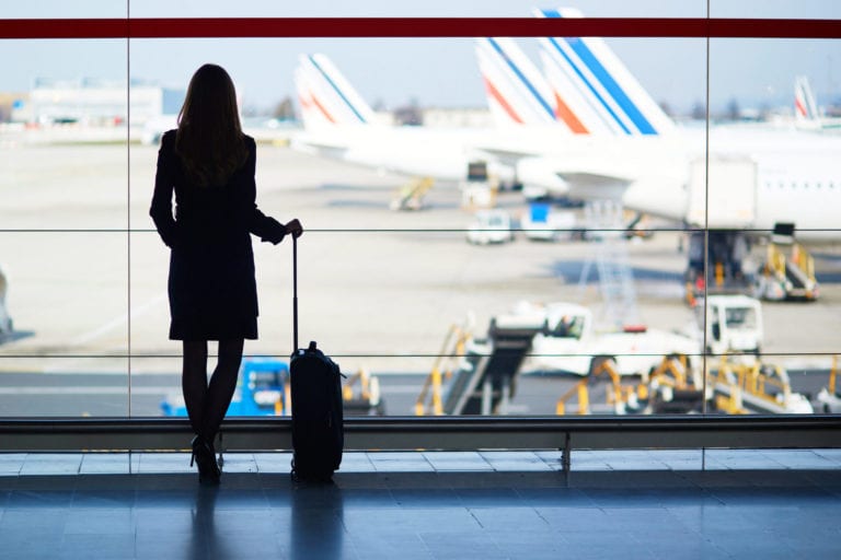 A woman's silhouette stands in front of a window at the airport | © Ekaterina Pokrovsky/Shutterstock