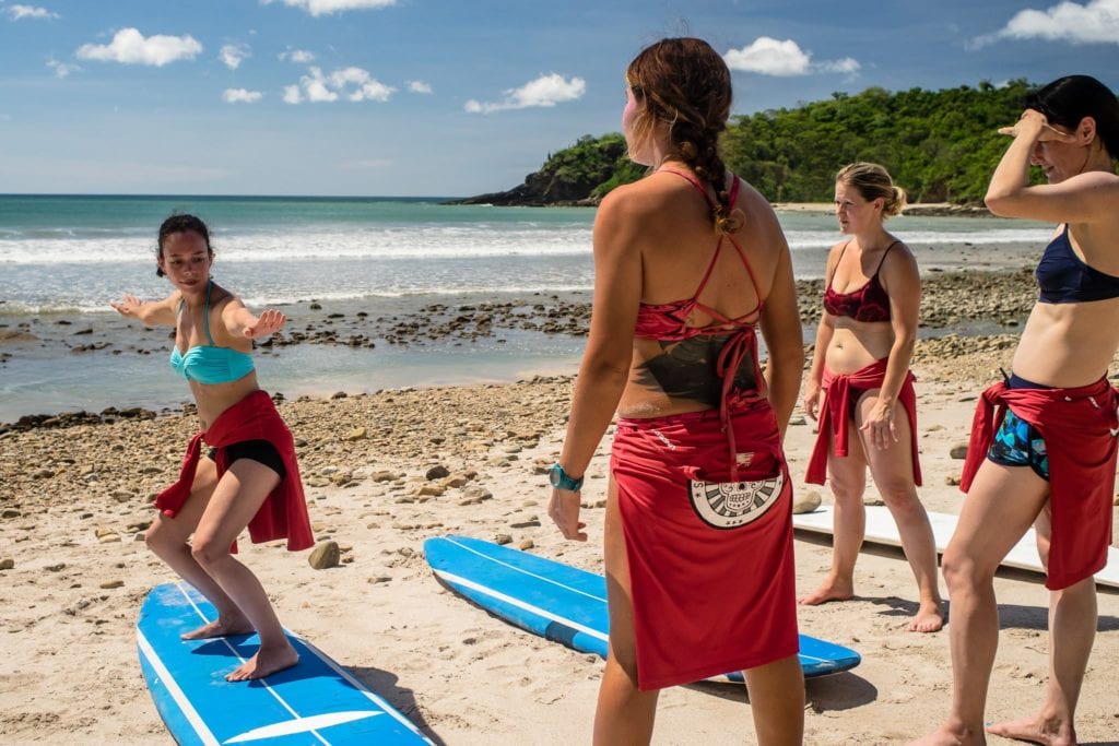 Travelers learning surfing in San Juan del Sur  | © Courtesy of Traverse Journey's Facebook Page, Photo by Jim Hill