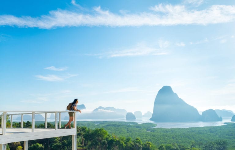 A woman looks out over a mountain view in Khao Samed Nang Chee Viewpoint in Thailand | © weedezign/Shutterstock