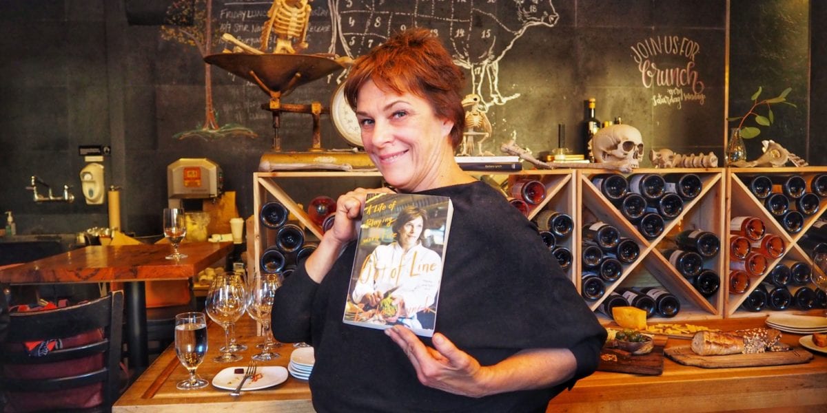 Chef Barbara Lynch poses with her new memoir | © Nikki Vargas/Unearth