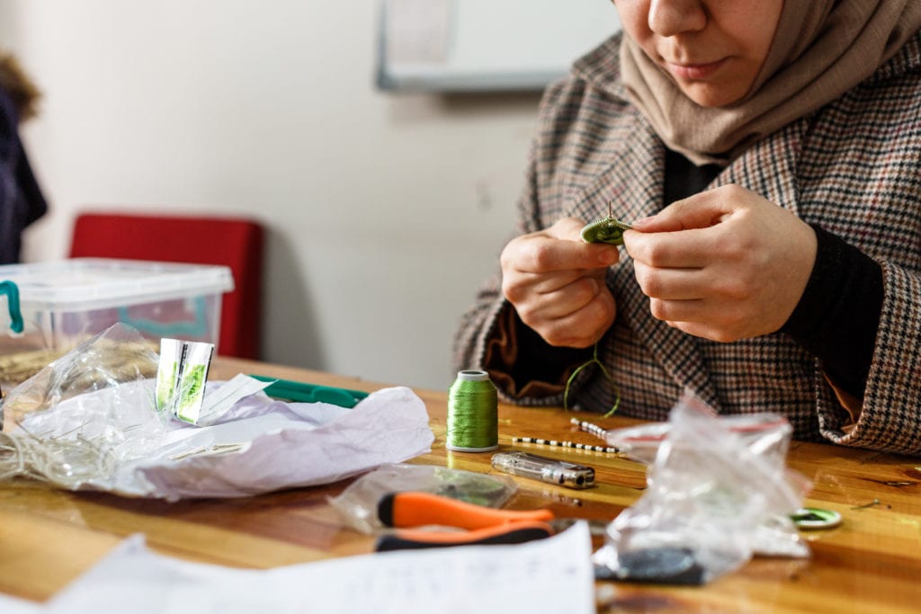 One of the women part of the Drop Earrings Not Bombs Project | © Annapurna Mellor