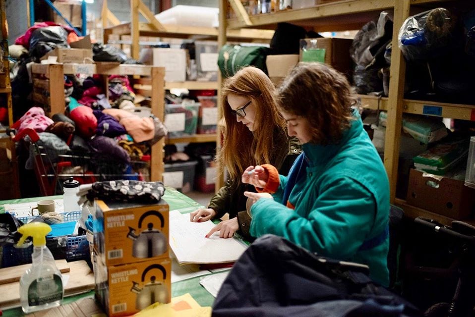 RWC volunteers sort through orders in their donations warehouse. They are continuing to distribute necessary items via an order system during the pandemic | © Human Rights Observers