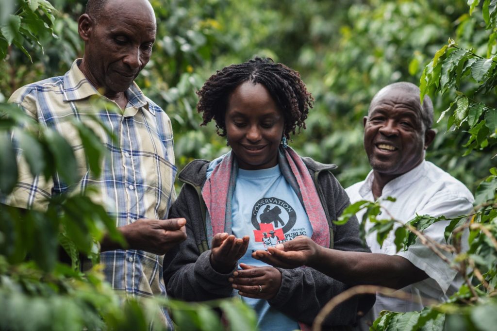 Dr. Gladys with Gorilla Conservation Coffee lead farmers, Vincent and Sam Karibwende © | JMcArthur/Unbound Project
